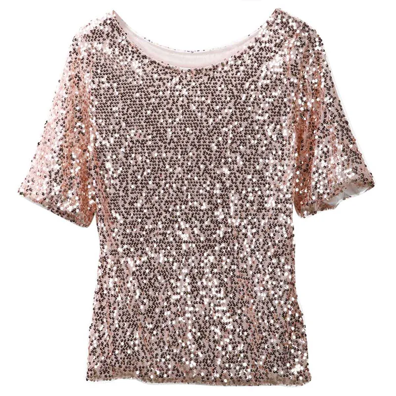 Woman wearing sloping shoulder sequin T-shirt in a casual streetwear setting with soft lighting 01