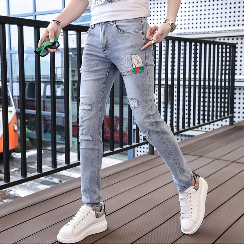 2024 spring and summer new hot drill hole men's jeans printed trend elastic Slim small leg pants high-end versatile men's pants