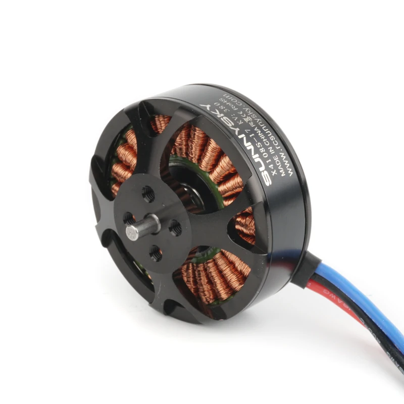 Moteur brushless haute performance 380KV-690KV pour drone RC multicoptère, posé sur une surface avec une hélice à côté.