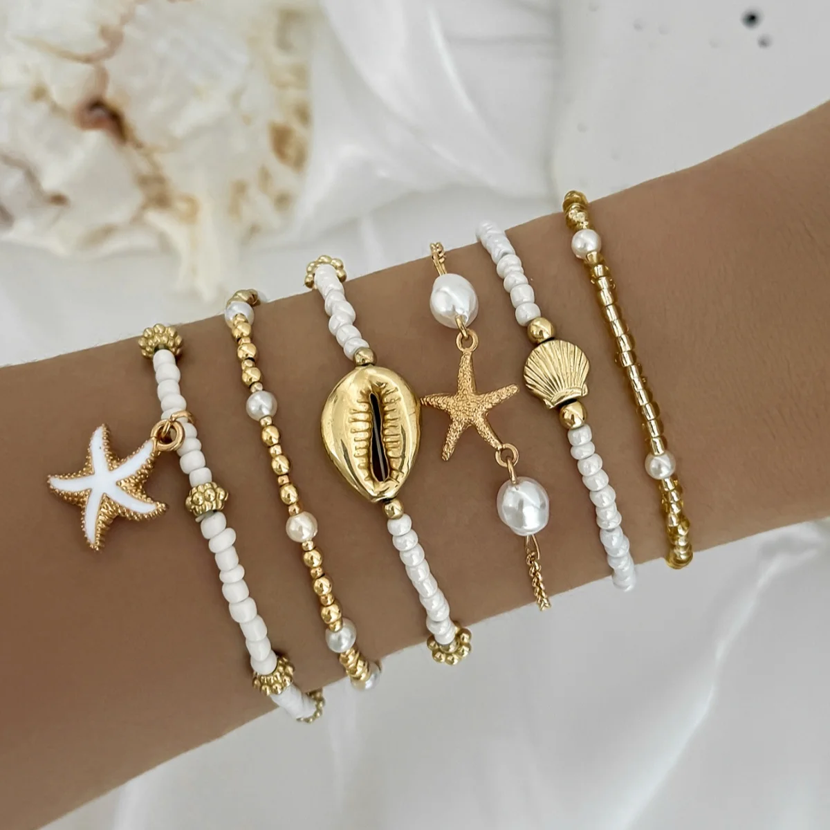 Conjunto de pulseiras vintage de missangas com estrela e concha_voghion.com