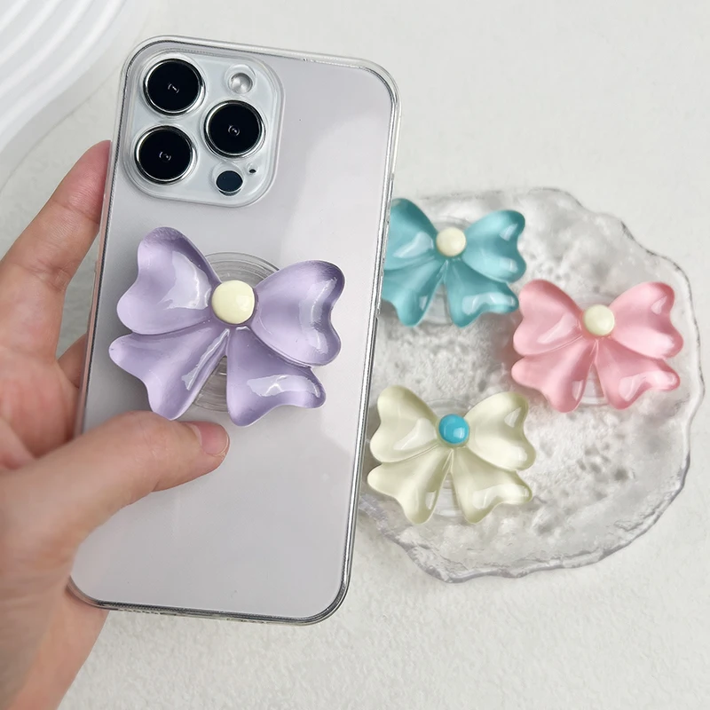 Candy Colored Bow Phone Stand with Cute Socket Grip and Folding Feature