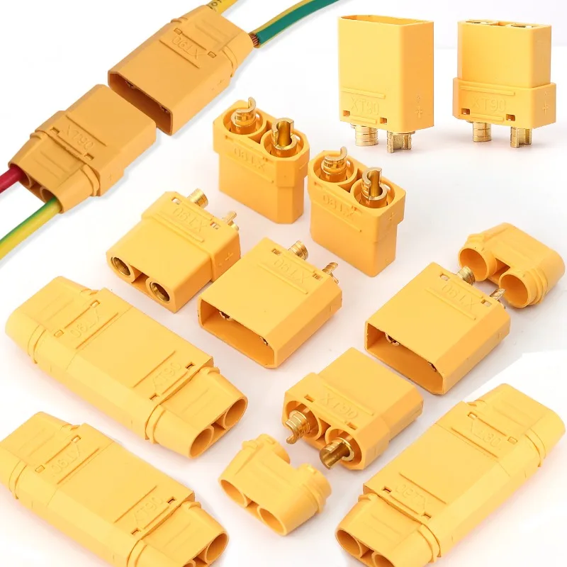 Vue rapprochée des connecteurs XT90 mâle et femelle pour batterie RC, avec cosses à souder.