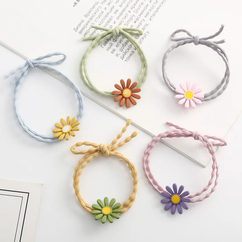 

Japanese and Korean hair accessories for children, featuring sweet little daisy hair rings, hair ropes, and rubber bands for bab