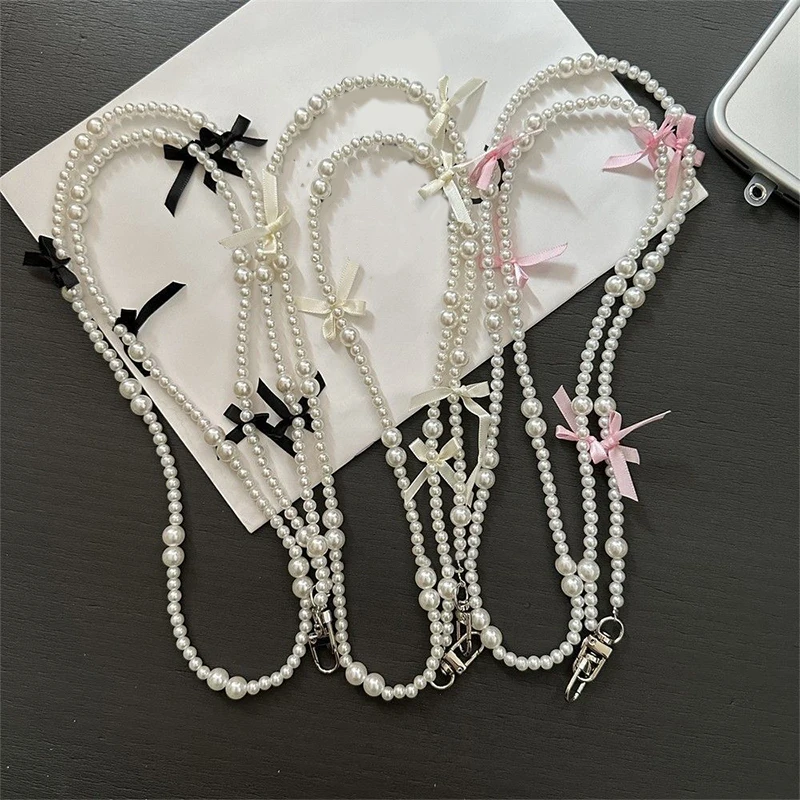 Elegant Pearl Bow Crossbody Phone Lanyard with Universal Anti-Lost Design
