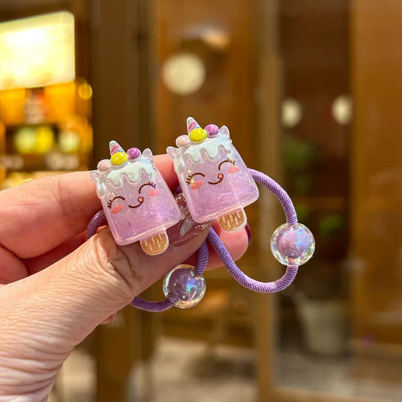 Two pieces of elastic hair ties in beautiful rainbow colors for girls, children's hair accessories, and stylish elastic headbands.