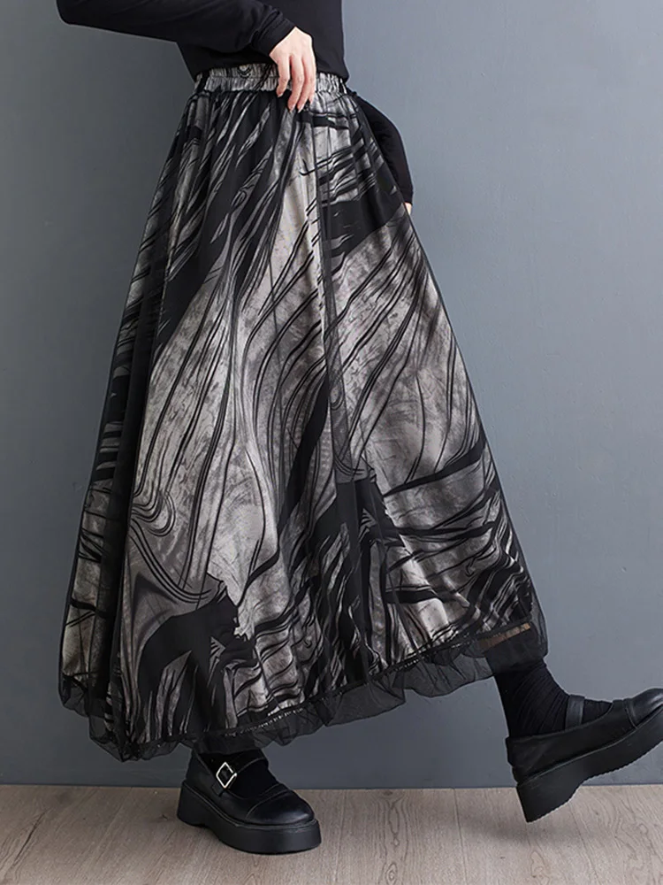 [EAM] High Elastic Waist Black Dot Printed Mesh Spliced A-line Half-body Skirt Women Fashion Tide New Spring Autumn 2026 1DJ0329
