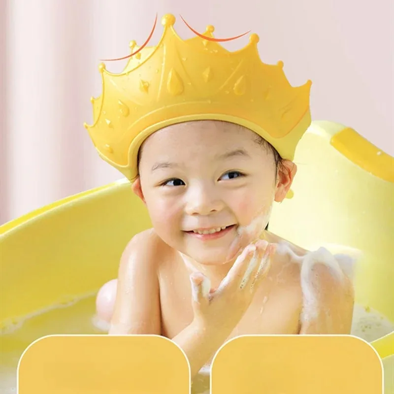 Child wearing a waterproof shampoo hat while taking a bath