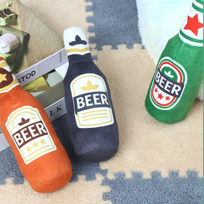 Soft fleece pet chew toy with internal squeaker and bottle print.