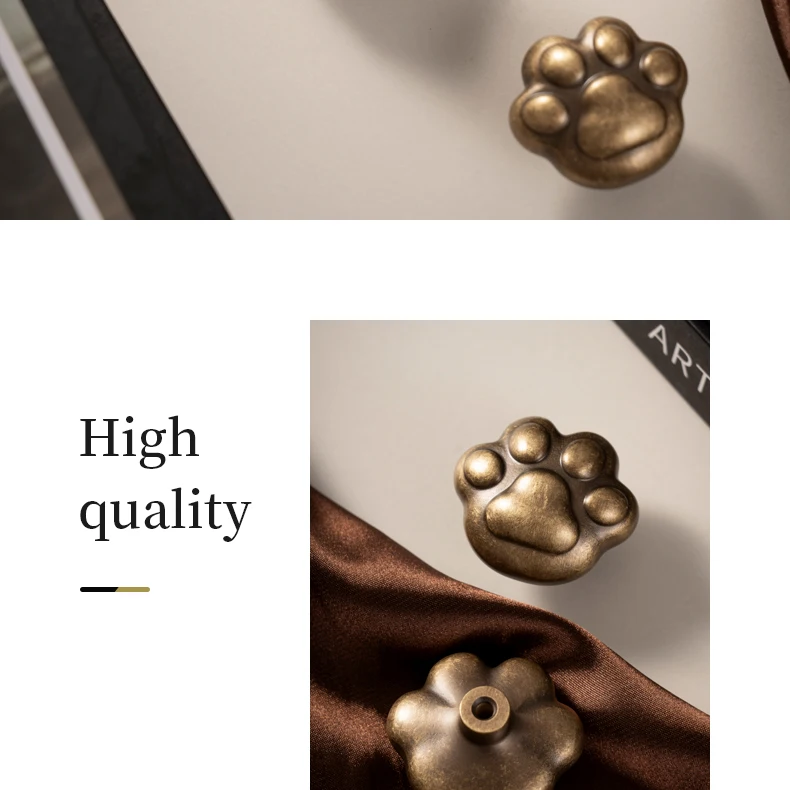 round antique brass dresser knob with cat paw design