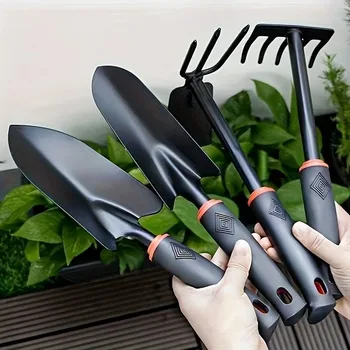 Durable metal gardening trowel with ergonomic black handle and orange decoration - perfect for planting flowers and vegetables.
