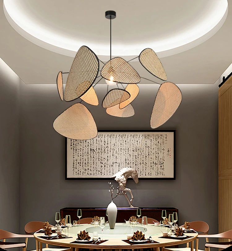A modern dining room with a wooden table, chairs and modern wicker chandelier