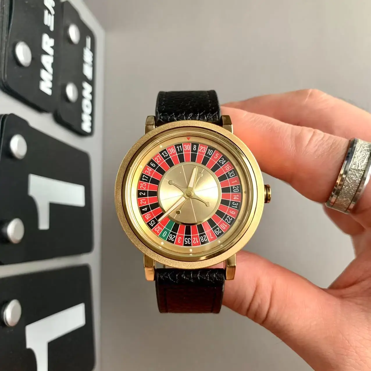 Luxury Gold-Tone Sports Watch with Unique Rotating Dial Design