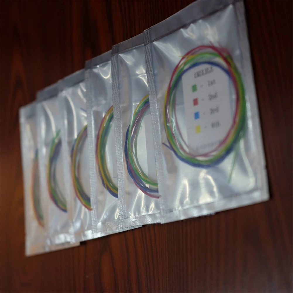 Sa39ab30a8743414c889c1af112aa075aH 4pcs Ukulele Strings Rainbow Colorful Guitar Strings For Acoustic Folk Guitar Classic Guitar Multi Color Parts Mallzona