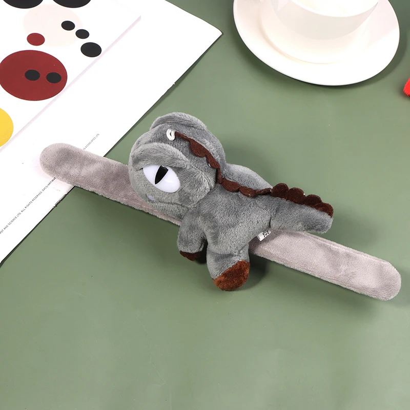 thumbnail image 1 of Pulsera de dinosaurio de peluche con forma de círculo para aplaudir, de dibujos animados de 2024, con forma de tiranosaurio, para el año del dragón, 1 of 5