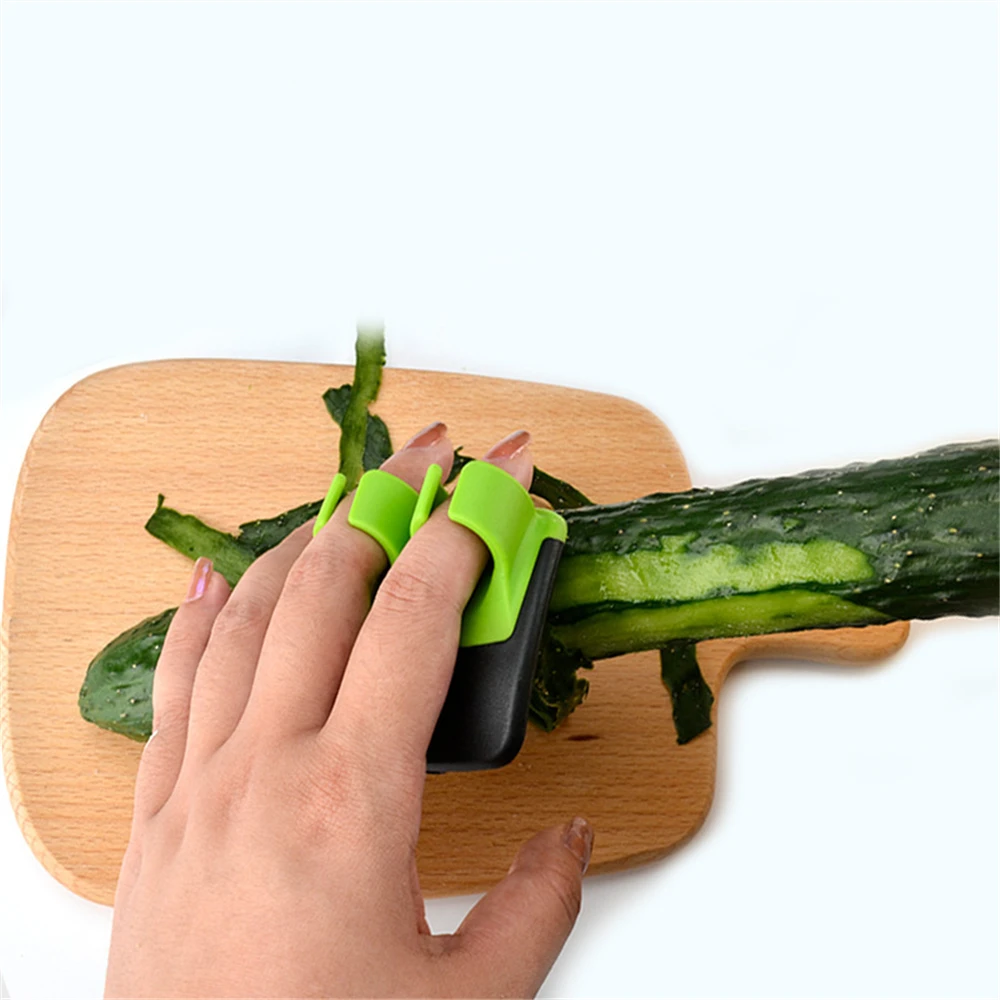 https://ae01.alicdn.com/kf/Sa446d8e74e6344d5ba06e06782fc91efm/Sharp-Blade-Creative-Finger-Held-Peeler-Easy-Hold-Stainless-Steel-Household-Multi-function-Planer-Fruit-Knife.jpg