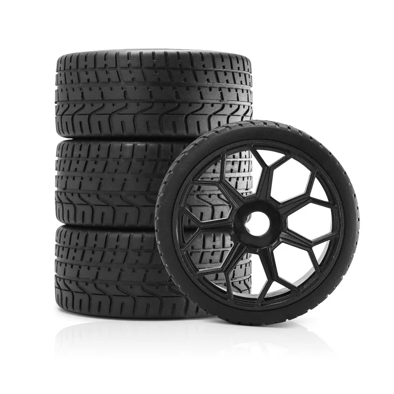Pneus de course ARRMA 1/7 INFRACTION 100mm 17mm pour voitures RC haute vitesse, photographiés sous un angle dynamique.