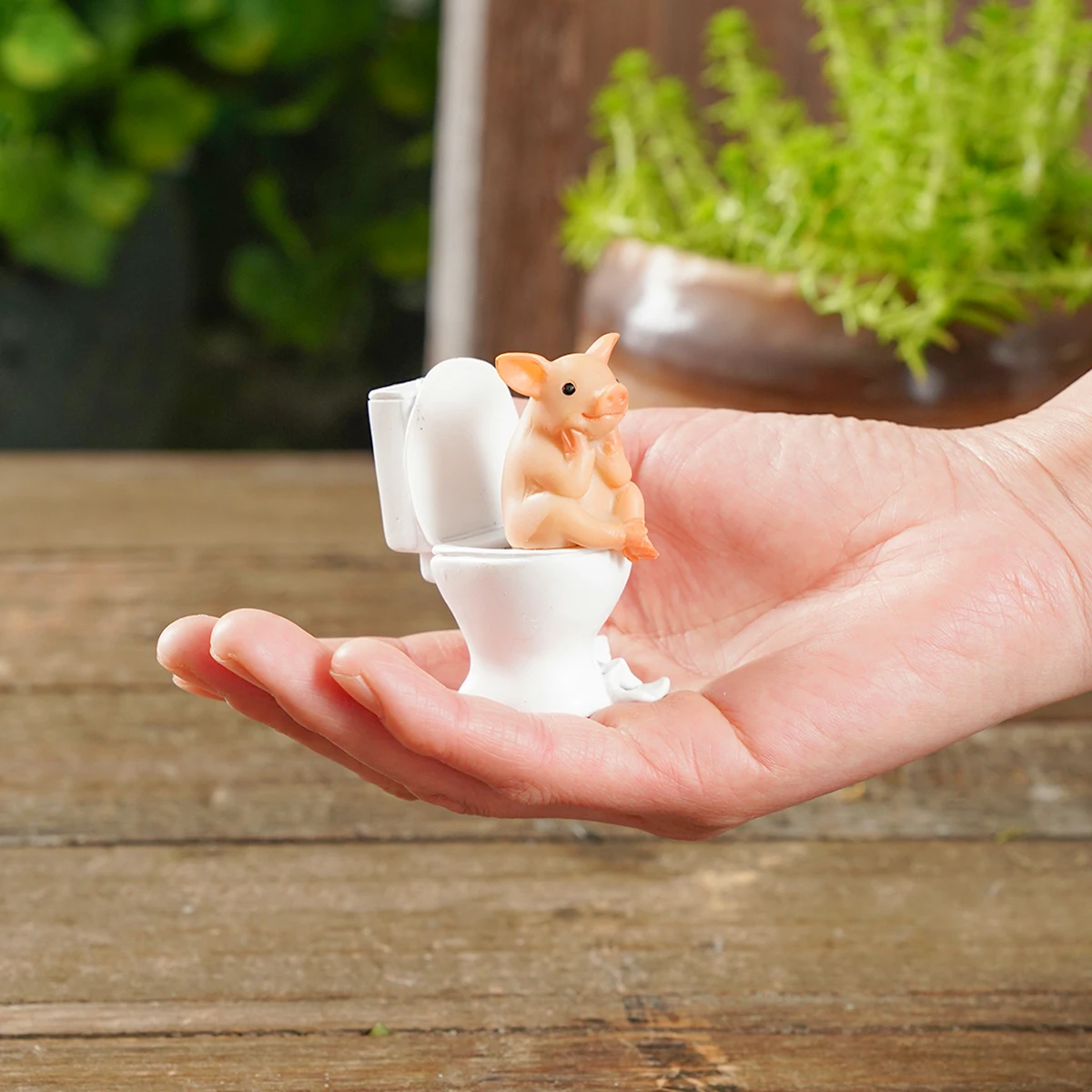 1PC, 1.3*2.5 inch resin material cartoon piggy toilet shape home decoration for home decoration of home courtyard garden