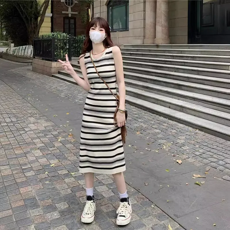 

Striped Sleeveless Knitted Camisole Dress for Women's Summer New Slimming French Slim Fit Mid Length Skirt with Wrapped Buttocks