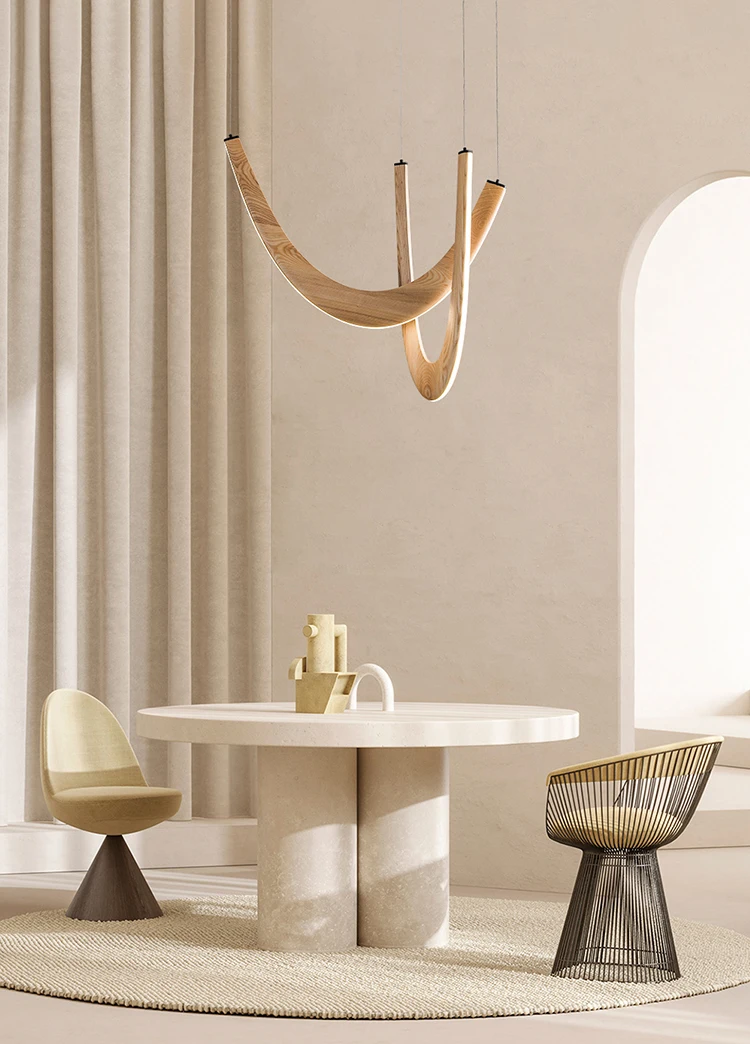 Minimalist dining area with a round table, two modern chairs, a Double Curve Wood Pendant Light, and neutral-toned decor atop a circular rug.