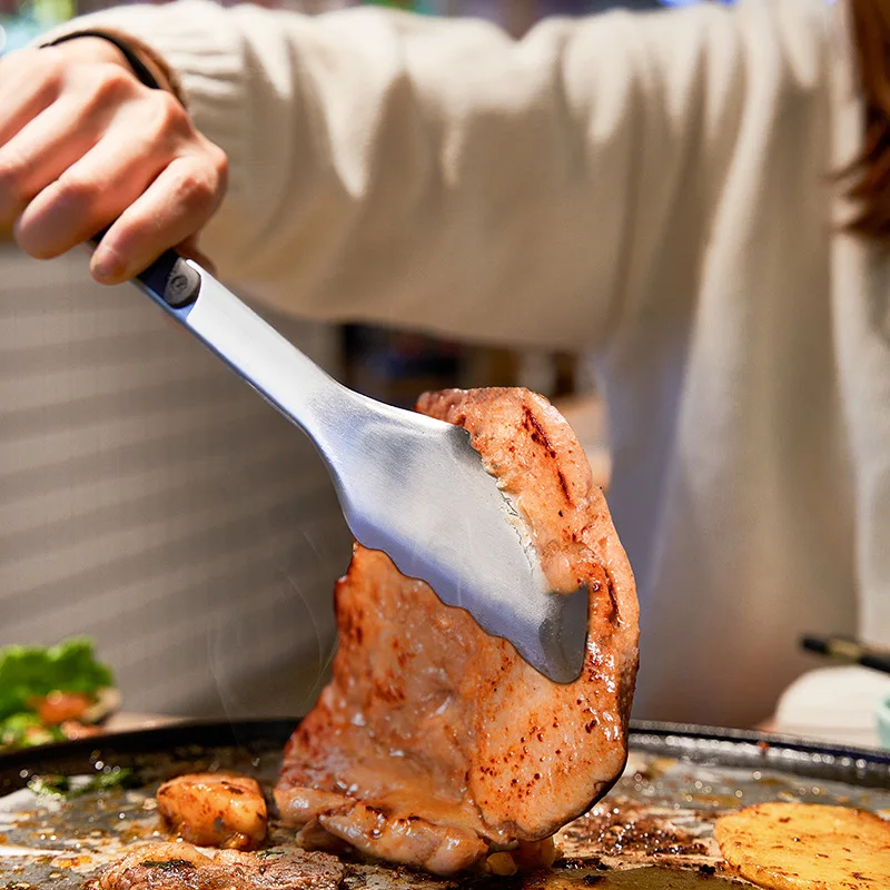 

2023 New Stainless Steel Barbecue Food Clip - The Ultimate Barbecue Steak Accessory for Grilling EnthusiastsIntroducing the gam