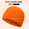 Soft orange fleece winter hat, thermal and comfortable for cold weather. Perfect for outdoor activities and casual wear, offering warmth and style.
