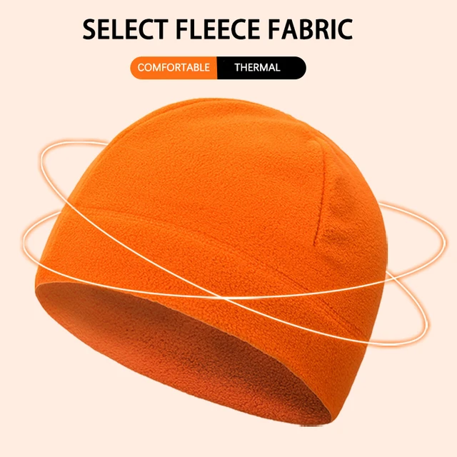 Soft orange fleece winter hat, thermal and comfortable for cold weather. Perfect for outdoor activities and casual wear, offering warmth and style.