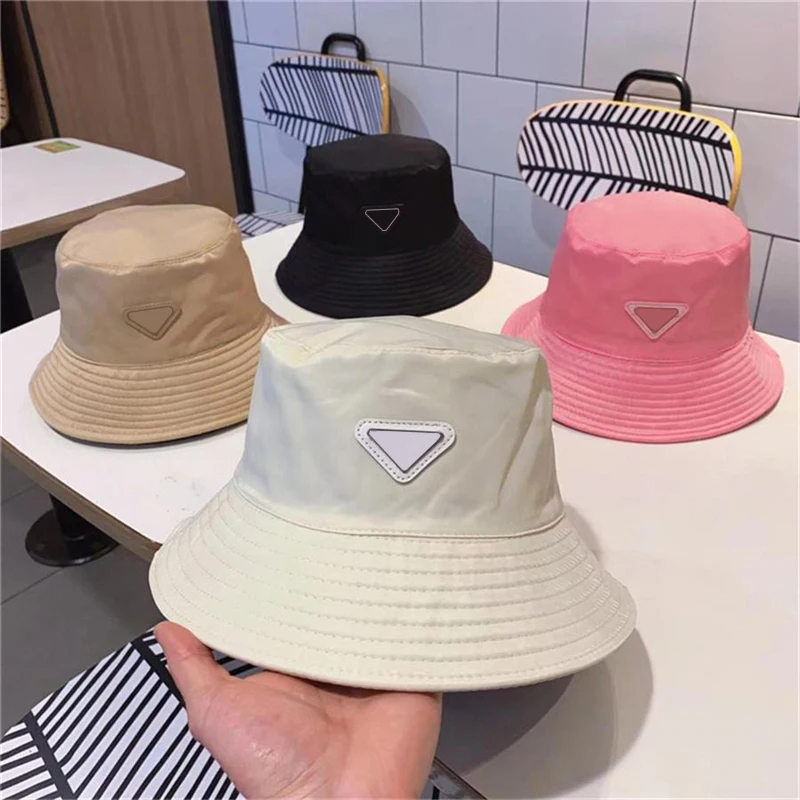 99874 Men and Women Triangle Bucket Hats Unix Luxury Designer Sun Beach Panama Hat Outdoor Solid Color Fisherman Metal LOGO Hats 2