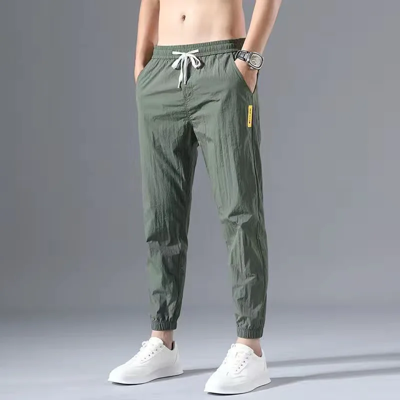 2024 Ice Shreds Men Summer Thin Style Trend Solid Color Loose Casual Motion Quick Drying Harun Bound Feet Large Size Trousers
