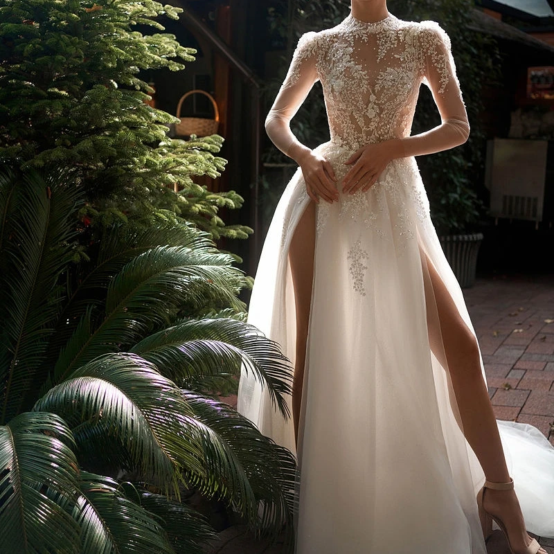 

2023 A Line Tulle Princess Appliques Wedding Dress High Neck Long Sleeve Button Back Sexy High Split Robe De Mariee