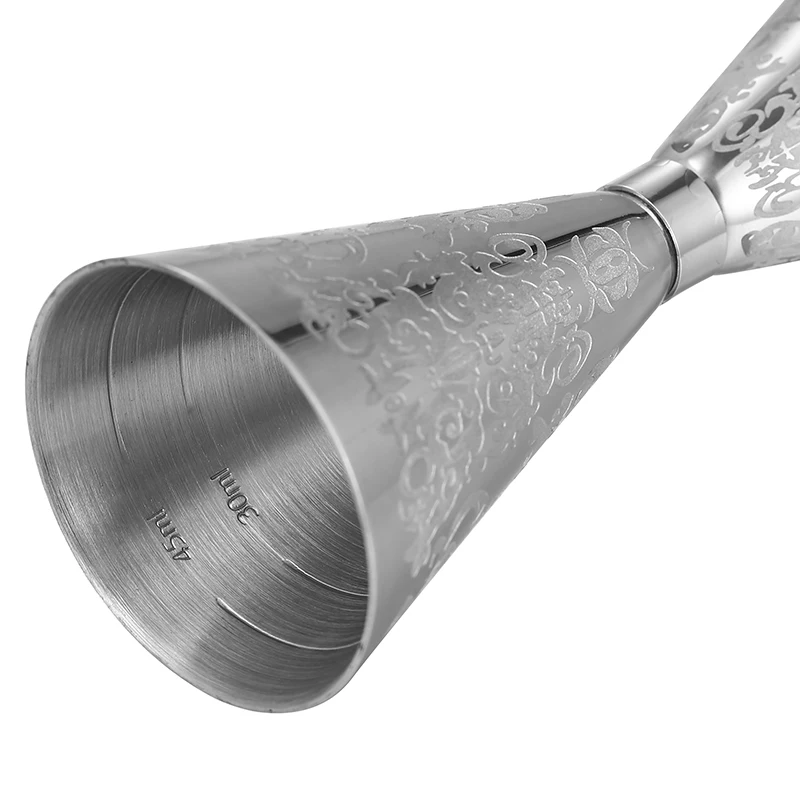 Assorted stainless steel cocktail jiggers for precise drink measurement in different sizes and finishes