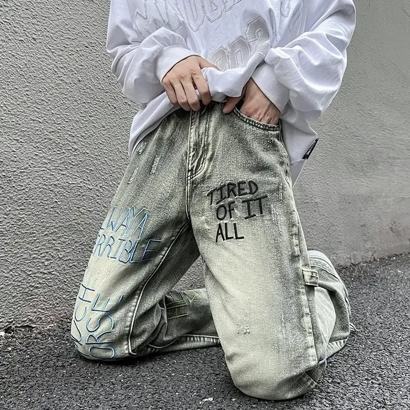 

Mud yellow jeans men design sense niche washed do old American retro zip embroidery drag trousers spring and autumn 2024