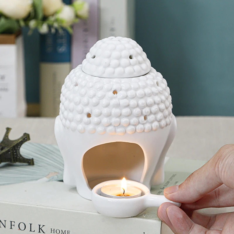 Portacandele a forma di testa di Buddha nero a forma di testa di olio essenziale bruciatore di incenso diffusore di candela per ornamento domestico