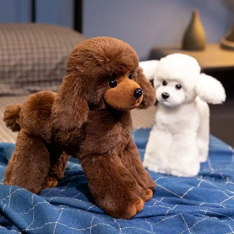 Cute white and brown handmade fluffy poodle plush toys displayed together on a blue surface.