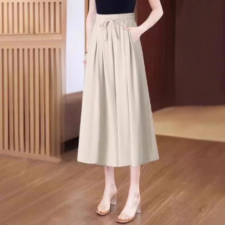 Three-quarter culottes in apricot color [drawstring with pockets]