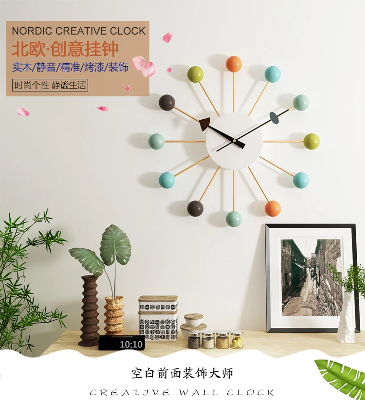 Nordic Style Colorful Ball Rim Art Wall Clock Movement: sweep second movement (quartz movement) Specifications: diameter 50cm Material: beech wood beads, piano paint process. Metal pointer, copper metal sleeve, with high-quality high-strength high-strength metal. Wrought iron rim, environmentally friendly pressure-resistant dial, matte paint one-piece molding. Silent movement, precise travel time, less than 15 decibels. Power consumption: AA battery Applicable scenarios: living room, dining room, etc. • Colma.do™ • 2023 •
