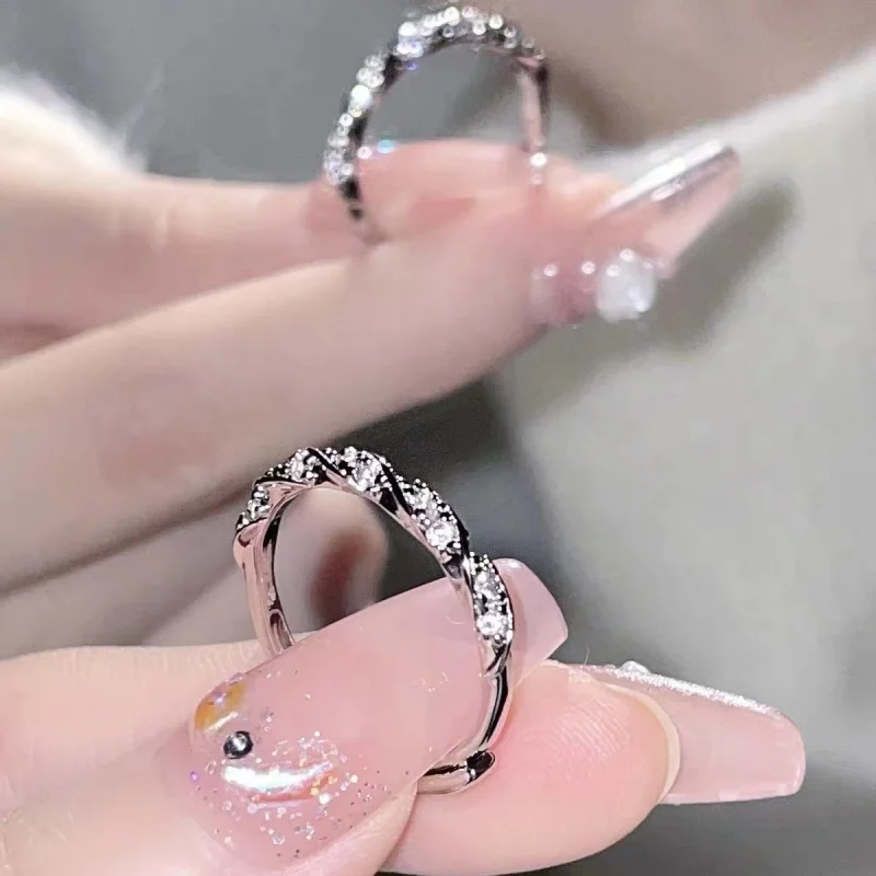 

925 sterling silver winding Love River broken diamond super flash twist open ring female niche light luxury boutique jewelry