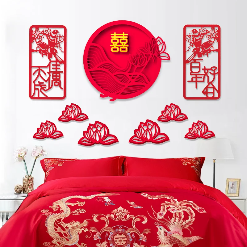 

Wedding room with auspicious characters pasted on the headboard, window, flower, and door of the bed