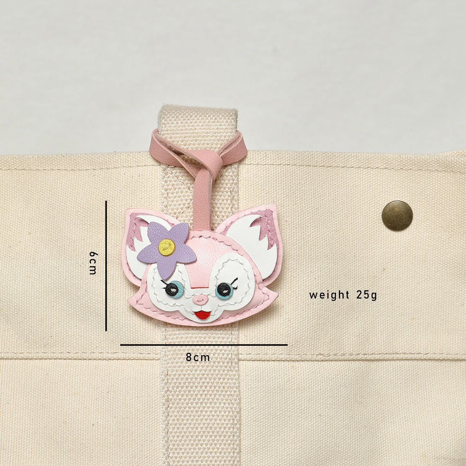 Pink fox goatskin leather bag charm front view