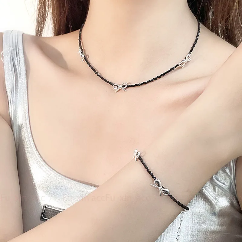 Elegant Beaded Bow Pendant