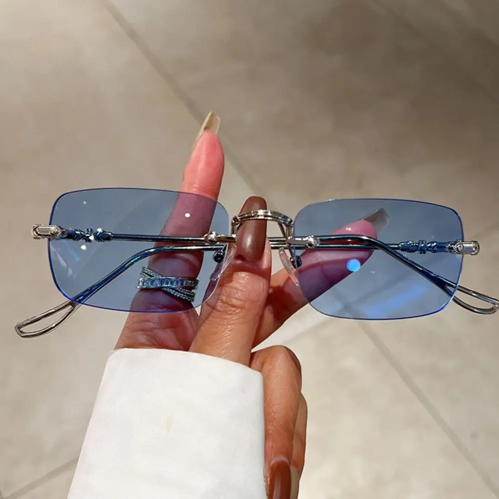 Sleek Unisex Rimless Metal Sunglasses with UV400 Ocean Lenses