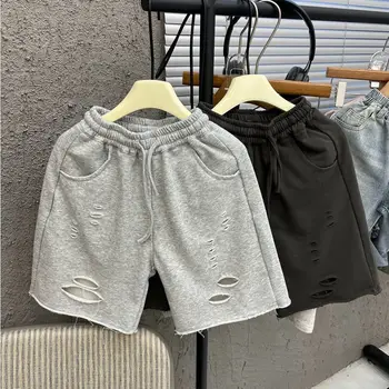 2025 Pantaloni strappati a vita elastica in stile coreano per bambini estivi Pantaloncini versatili a gamba larga larghi per ragazzi belli 1