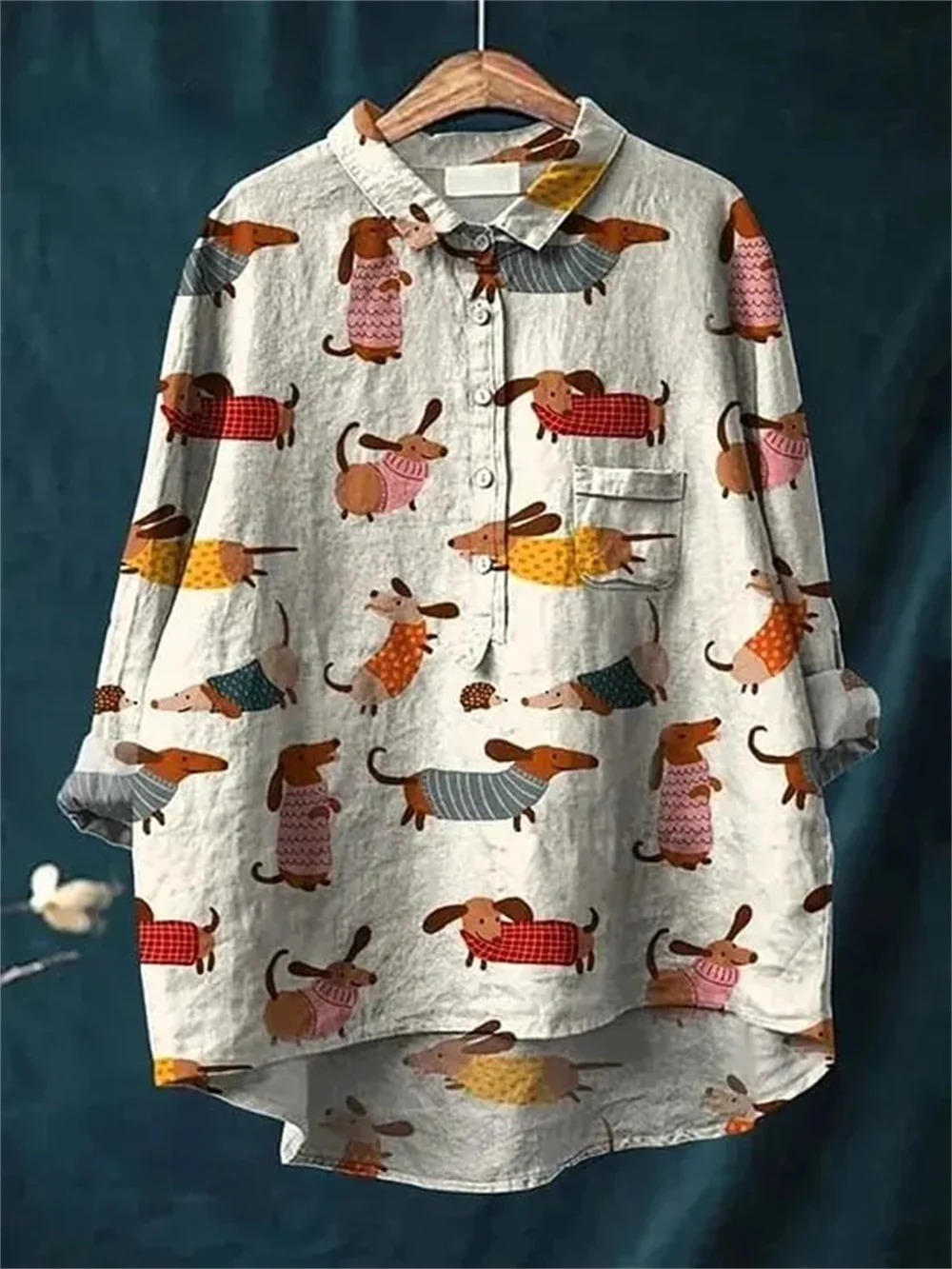 Women casual loose long sleeve tunic shirts in khaki, cream, and olive green colors featuring all over prints of cute cartoon dogs