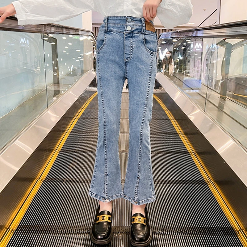 

Детские расклешенные джинсы для девочек, модные рваные брюки из денима с перекрестной кромкой и подолом-колоколом, повседневные длинные брюки для подростков, брюки в Корейском стиле