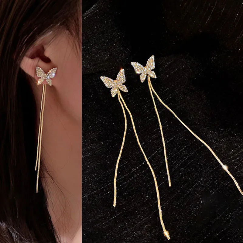 Eleganti orecchini pendenti a goccia a spirale in oro bianco