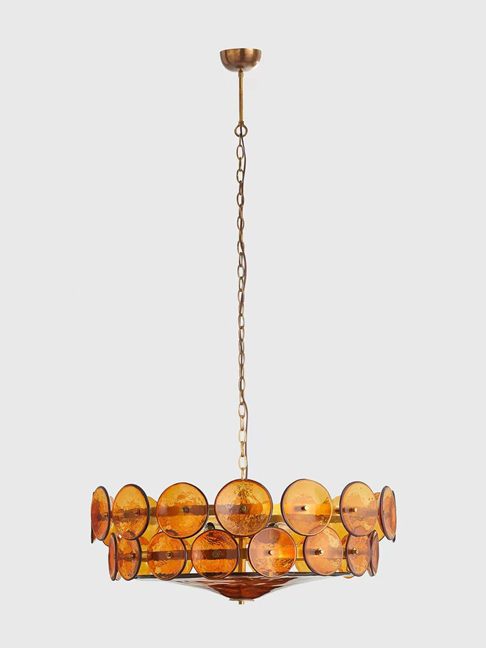 The Italian Retro Pendant Light is a circular Mid-Century Modern chandelier with a brass finish, suspended by a chain, and features amber glass discs arranged around the frame, reminiscent of Italian artisan lighting.