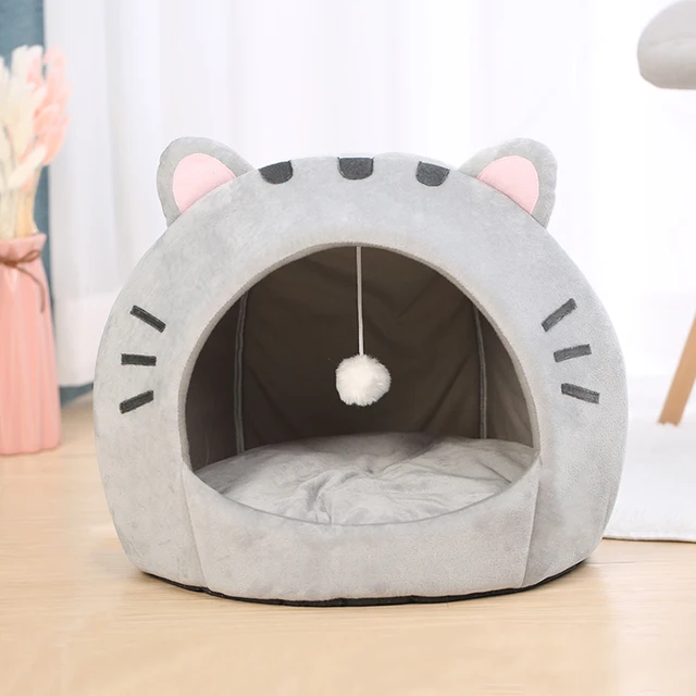 Cozy and comfortable cat bed with reversible cushion and dangling ball toy