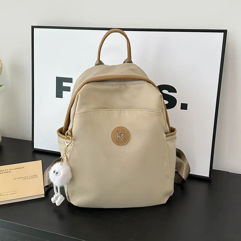thumbnail image 1 of Bolso de hombro sencillo para mujer, novedad de 2024, mochila para estudiantes de gran capacidad de tela de nailon impermeable, paquete de viaje informal ligero, 1 of 5