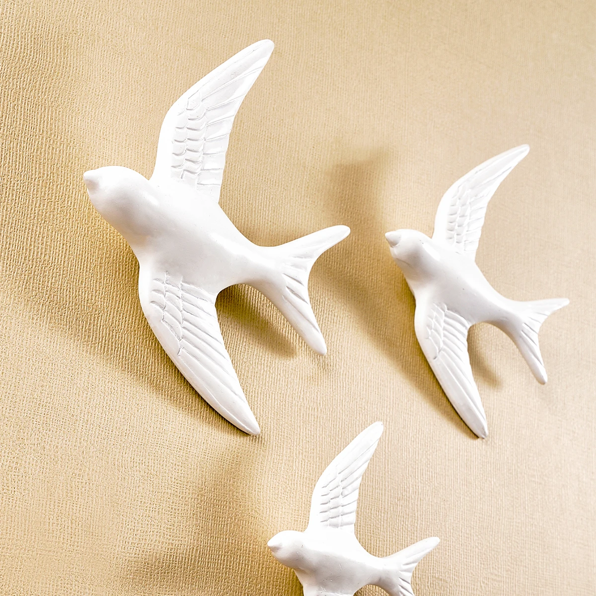 3 pieces, modern and simple white and gold swallow-like pendants spreading their wings in flight