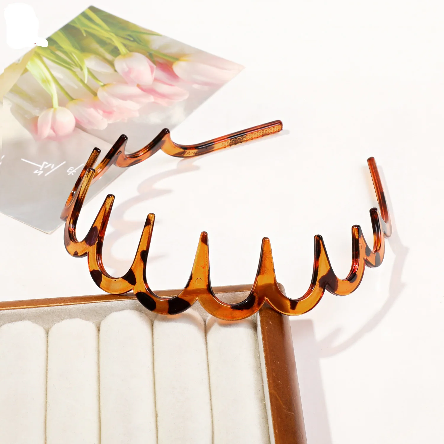 Celine headband in acetate and steel, specifically in a blond havana color. Celine Headband in Acetate and Steel - DARK HAVANA / GOLD  main image 2