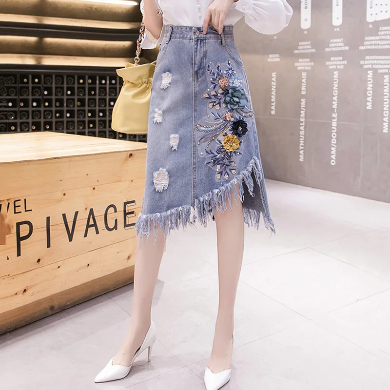 

Женщины Национальный стиль Цветочный Вышивка Джинсовая юбка Лето Новый Мода Повседневный Асимметричный Дыра кисточка Высокая талия Свободный Джинсовая юбка